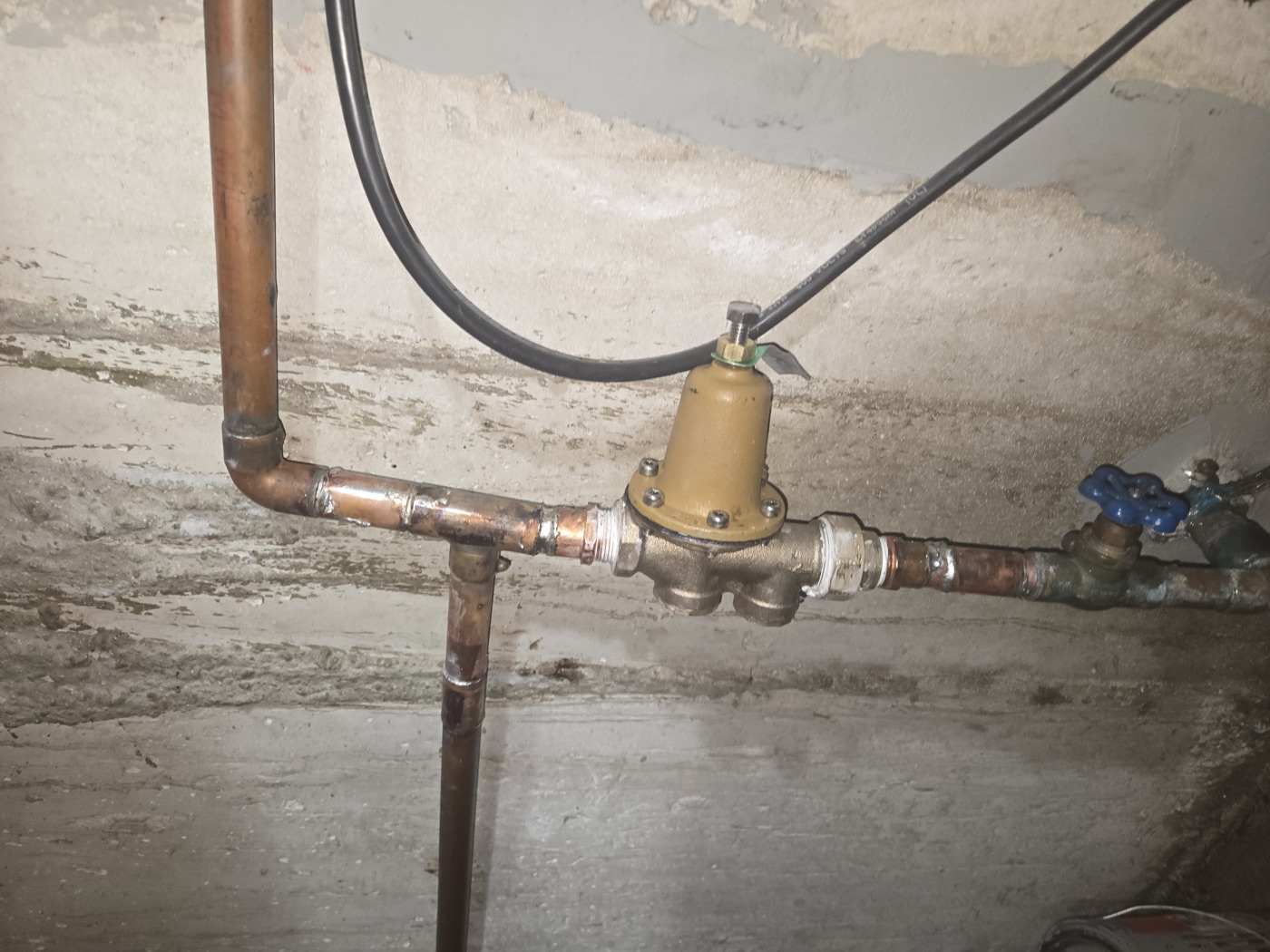 Pressure reducing valve installed on copper plumbing lines — handyman plumbing repair in Salt Lake Valley UT